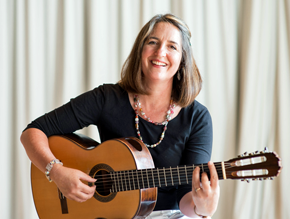 Berit Strong holding guitar